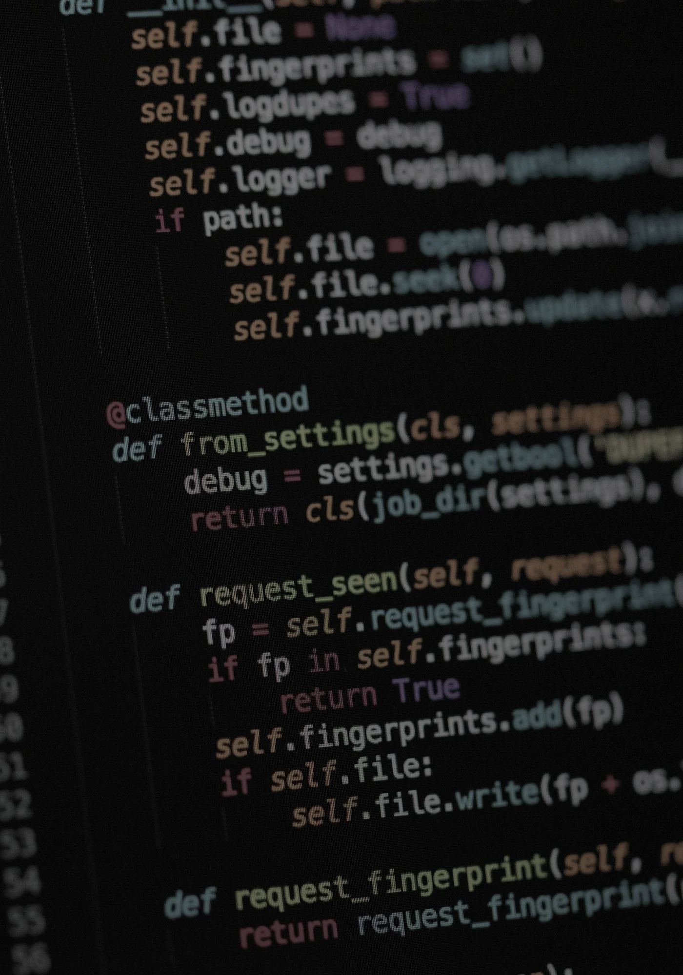Code editor on a dark monitor